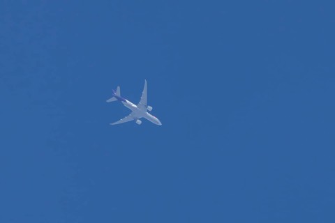 Airbus A300-600RF jet aircraft of FedEx Express airlines in flight in a blue sky, England, United