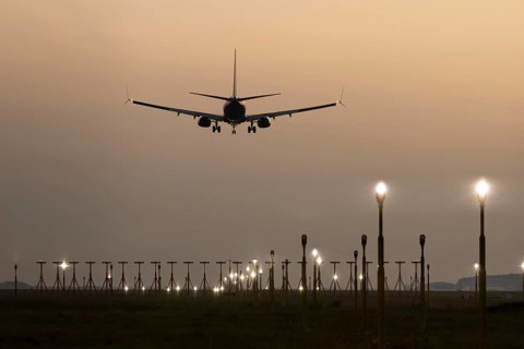 Boeing 737 jet passenger aircraft of Ryanair airlines in flight landing at sunset at London