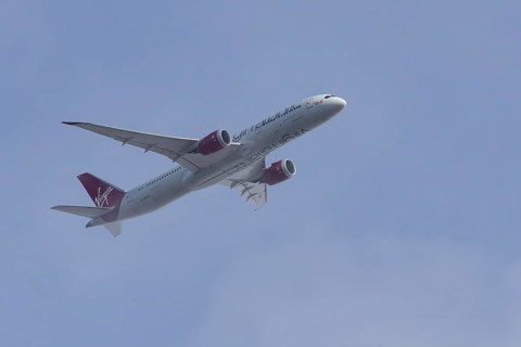 Boeing 787-9 Dreamliner jet passenger aircraft of Virgin Atlantic airlines in flight in a blue sky,