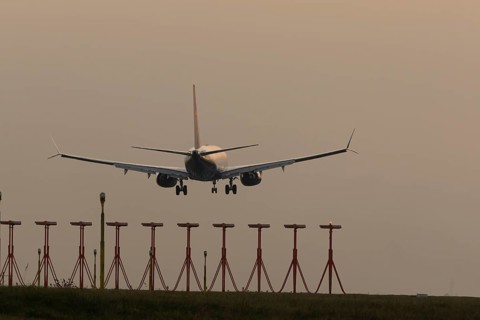 Boeing 737 jet passenger aircraft of Ryanair airlines in flight landing at sunset at London