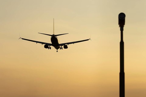Boeing 737 jet passenger aircraft of Ryanair airlines in flight landing at sunset at London