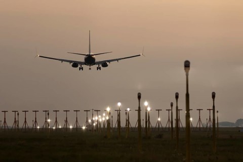 Boeing 737 jet passenger aircraft of Ryanair airlines in flight landing at sunset at London