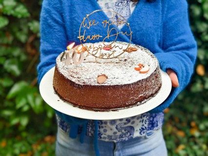 Chocolate cake with birthday decoration and icing held in the hands Lower Austria Austria
