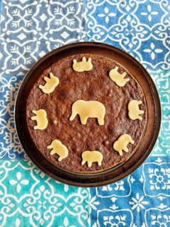 Round cake with elephant pattern made of chocolate dough on colourful cloth Lower Austria Austria