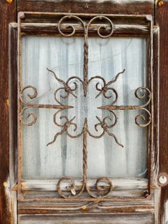 Old, rusty window grille in a weathered wooden frame Lower Austria Austria