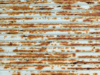 Rusty metal surface with brown and white structures in horizontal lines Lower Austria Austria