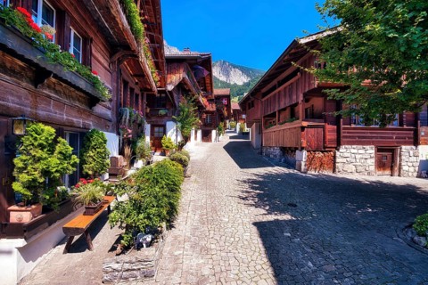 Alley with old wooden houses in Brienz, Canton of Bern, Switzerland