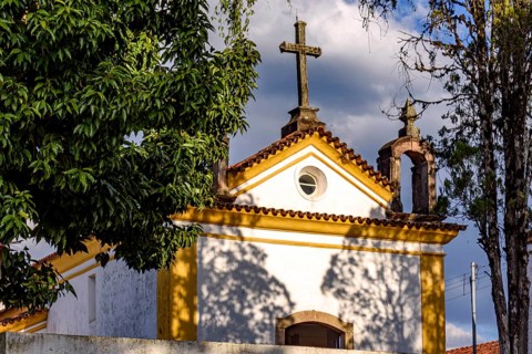 Facade of a church from the early 18th century among the vegetation in the city of Ouro Preto
