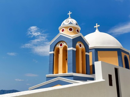 Catholic Church of Saint Stylianos, colourful facade, domes, Fira, Thira, Santorini, Cyclades,