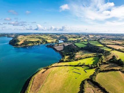 Farms and Fields over St Mawes from drone, Carrick Roads, River Fal, Falmouth, Cornwall, UKDefault