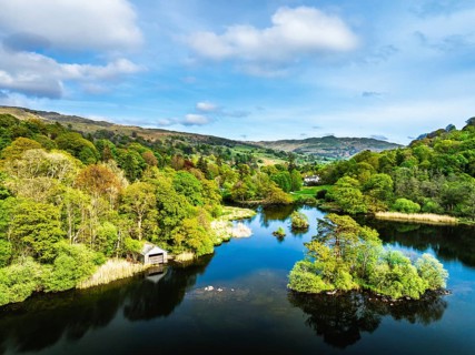 Farms and Mountains over road A591 from a drone, Grasmere Lake, Grasmere, Ambleside, Lake District,