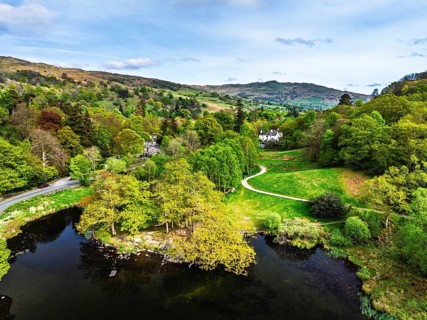 Farms and Mountains over road A591 from a drone, Grasmere Lake, Grasmere, Ambleside, Lake District,