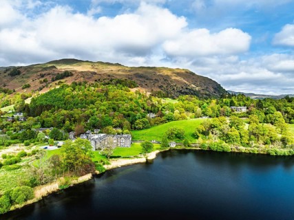 Farms and Mountains over road A591 from a drone, Grasmere Lake, Grasmere, Ambleside, Lake District,