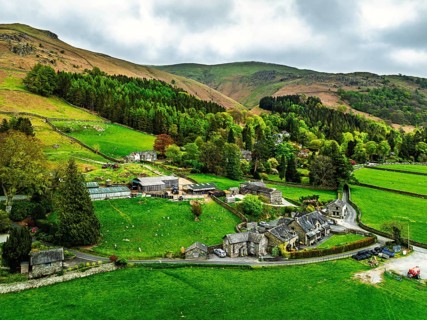 Farms and Mountains over road A591 from a drone, Grasmere Lake, Grasmere, Ambleside, Lake District,