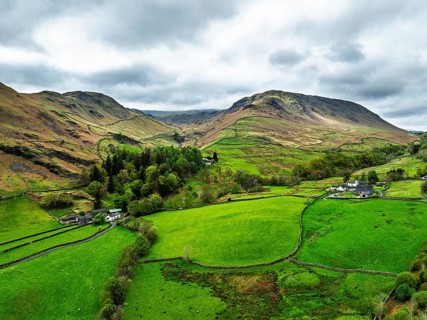 Farms and Mountains over road A591 from a drone, Grasmere Lake, Grasmere, Ambleside, Lake District,