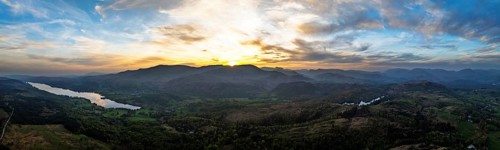 Panorama of Sunset over Mountains and Coniston Water from drone, Lake District National Park,