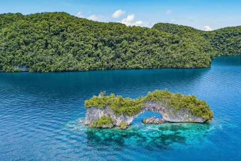 Aerial view bird's eye view of rock arch Natural Arch in lagoon of island paradise island state