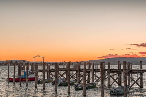 Sunset over a wooden footbridge in Allensbach, Lake Constance, Baden-Württemberg, Germany