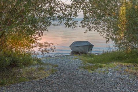 Rowing boat on the shore of Reichenau Island, Lake Constance, Baden-Württemberg, Germany
