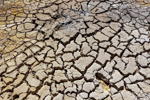 Cracked and dry soil in a volcanic environment, the mud volcanoes and fumaroles on the Altiplano in