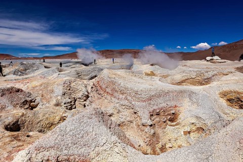 Colourful mineral deposits in geysers, steam emissions, vast desert skies, the mud volcanoes and