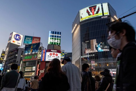 Crowd crossing the zebra crossings of Shibuya Crossing, world-famous intersection in Shibuya