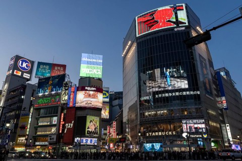 Crowd waiting at the zebra crossing of Shibuya Crossing, world-famous intersection in Shibuya
