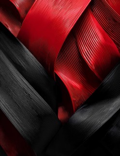 Abstract close-up of red and black textured ribbons intertwined, creating a vibrant background,
