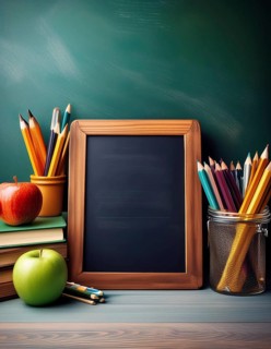 A collection of school supplies, including pencils, books, and apples, arranged on a desk with a