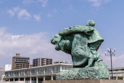 Statue of mother and children in the storm, bronze statue by the artist Shin Hongo in front of the