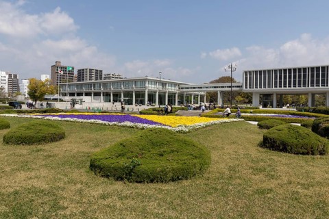 Colourful flower beds in front of the Hiroshima Peace Museum, tourist attraction, UNESCO World