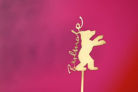 Background image, close-up, logo, golden bear with Berlinale lettering at a press conference during