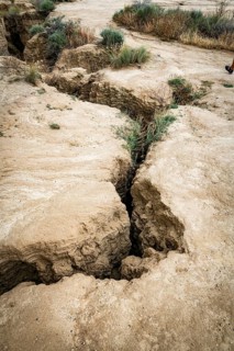 Cracks in arid soil reveal changes caused by erosion, in bardenas reales in spain, highlighting the