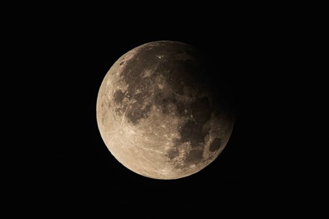 Partial lunar eclipse with detailed crater landscape. Frankfurt am Main, Hesse, Germany