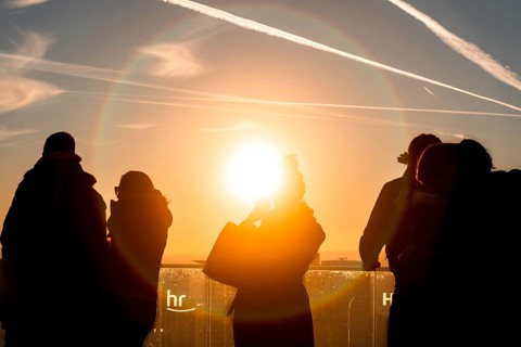 The golden hour delights visitors to the Main Tower. Banking district, Frankfurt am Main, Hesse,