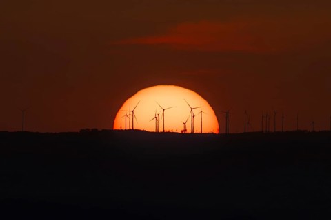 Sunset over a wind farm. Großer Feldberg in the Taunus, Hesse, Germany