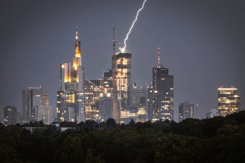 Lightning strikes over Frankfurt, force of nature in the centre of the city. City centre of