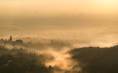 Frankfurt skyline sinks into the early morning fog. Dettweiler Tempel, Königstein im Taunus, Hesse,