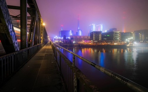 West cogeneration plant shines through dense fog. Gutleutviertel, Frankfurt am Main, Hesse, Germany