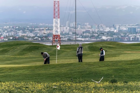 Golfing with a view of Reykjavik. Fairways meet Icelandic skyline. Reykjavik, Iceland