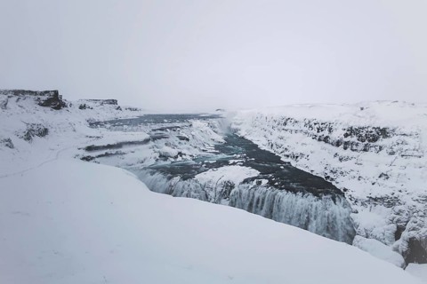 The mighty Gullfoss waterfall in a snowstorm. Golden Cirlce, Haukadalur, Iceland