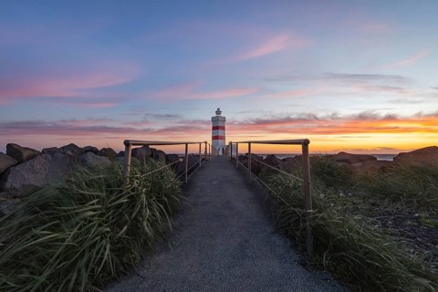 Gardur lighthouse at sunset. Gardur, Reykjanes, Iceland