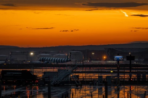 A plane lands shortly after a thunderstorm. Frankfurt Airport, Hesse, Germany
