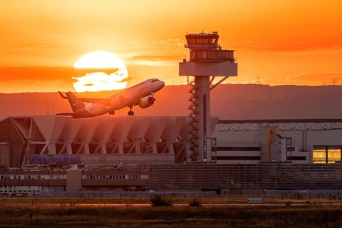 Departure between tower and sunset. Frankfurt Airport, Hesse, Germany