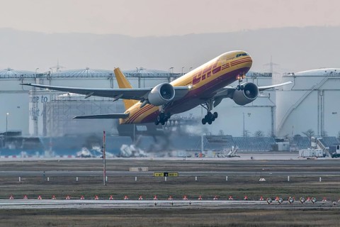 DHL cargo plane takes off with a full load. Frankfurt am Main Airport, Hesse, Germany