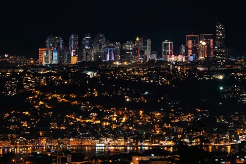 Sparkling skyline meets vibrant city lights on the Bosphorus. Istanbul, Turkey