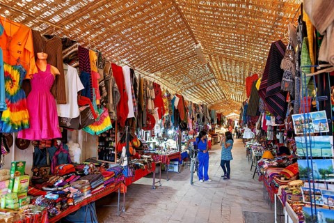 A lively market with a variety of colourful clothing, textiles and souvenirs. Traditional crafts