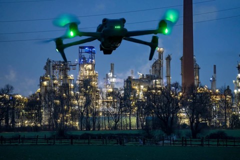 Symbolic image, photomontage, reconnaissance, spying with drones in industrial plants, critical