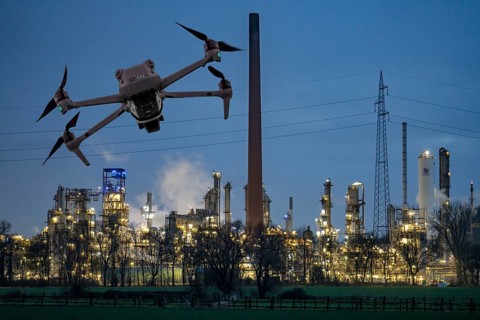 Symbolic image, photomontage, reconnaissance, spying with drones in industrial plants, critical