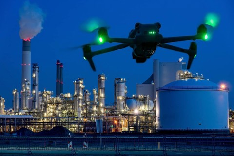 Symbolic image, photomontage, reconnaissance, spying with drones in industrial plants, critical